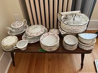 Full view of RC Japan dinnerware set on table including teapot, covered dish, plates, bowls, gravy boat, and serving pieces