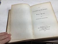 Open book showing title page with title, author, and publication details