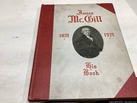 Front cover of the yearbook showing title 'James McGill His Book 1821-1921' with a portrait and red spine.