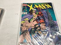 Photo shows the front cover of The Uncanny X-Men #274 comic by Marvel Comics with multiple characters featured.