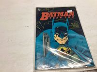 Batman Year Two comic book in plastic protective sleeve showing front cover with Batman holding a gun.