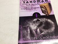Front cover of The Sandman graphic novel Vol 1: Preludes & Nocturnes showing title, author and artwork