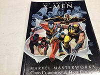 Front cover of The Uncanny X-Men Marvel Masterworks graphic novel showing main X-Men heroes in action.