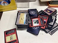 Multiple Star Wars trading cards with various characters and scenes shown from front and back sides.