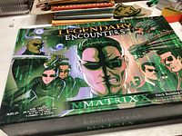 Boxed card game titled 'Legendary Encounters Matrix' with characters from the Matrix movie series on the cover.