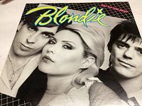 Front cover of Blondie Eat to the Beat album showing band members and album title graphics.