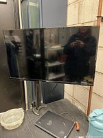 Front view of the RCA 32 inch TV showing screen and casing.