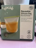 Photo of unopened box packaging of Lékué reusable silicone zip lock bag showing brand, product type, and bag image.