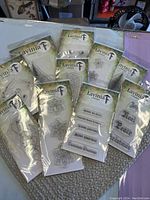 Photo showing approximately 13 clear rubber stamps from Lavinia with various floral and Christmas-themed designs.