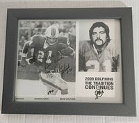 Framed black and white photo showing Jim Kiick in action and portrait, with autograph and team branding.