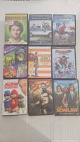 First photo showing 9 DVDs including Knocked Up, Varsity Blues, Spider-Man animated, Alvin and the Chipmunks
