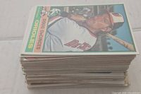 Stack of vintage baseball cards with Doug DeCinces Orioles card on top