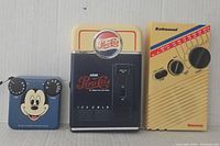 Photo showing all three radios in the lot: Mickey Mouse, Pepsi-Cola, and Bathsound Newsweek.