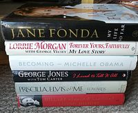 Stack of six hardcover biographical books showing titles and author names, arranged horizontally to display spines.