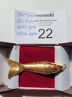 Pendant in presentation box showing ring loop and overall shape