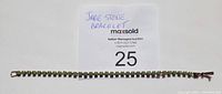 Full length photo of the jade stone bracelet laid flat with a label showing 'Jade Stone Bracelet' and MaxSold auction number 25.
