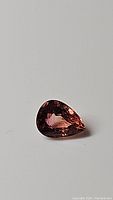 Pear cut natural Padparadscha tourmaline gemstone in orange-pink color, 0.80ct