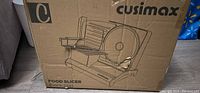 Box showing trademark and model information for Cusimax Food Slicer CMFS-2201