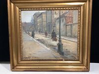 Frontal view of framed oil painting showing urban street scene