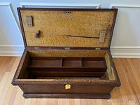 Open chest showing interior and removable tray with three compartments