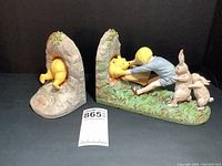 Pair of ceramic Winnie the Pooh bookends side by side showing full scene and sizes