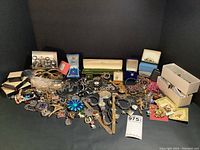 Wide view of assorted jewelry pieces and storage boxes