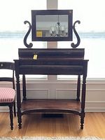 Front view of mahogany dressing table with swivel mirror and turned supports