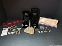 Group shot of rhinestone change purse and assorted jewelry