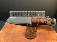 Ka-Bar MK2 knife with leather handle displayed beside ruler showing approximately 11.5 inch total length.