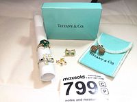 All five pieces displayed together with Tiffany blue box, felt pouch and ring roll