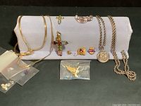 All items displayed on jewelry stand and bags