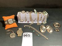 Overview of all sterling silver jewelry on pillow and display stand