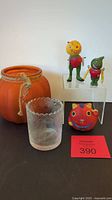 Lot displayed showing all items including two debbee thibault figurines, glass pumpkin, votive holder, and neko kitty figurine