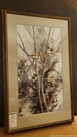 Full view of the framed print with the detailed vine branches and birds artwork visible, showing condition of frame and matting.