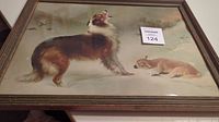 Full view of framed 1930s print showing a dog and a small pup lying down