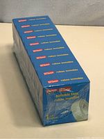 View of the lot of 10 sealed Staples invisible tape rolls stacked together, showing packaging and quantity.