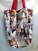 Side view of the tote bag showing collage print of Taylor Swift images and phrases.