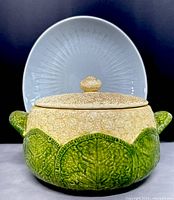 Photo of the vintage Cauliflora tureen showcasing the green leaf body and textured beige speckled lid and handles
