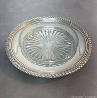 Top view of the sterling silver butter dish showing the glass liner with starburst pattern inside.