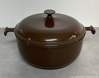 Front view of brown enameled cast iron casserole dish with lid