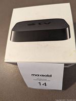 Box of Apple TV Model A1469 showing product image and packaging.