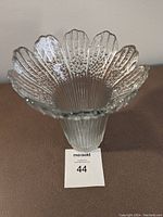 Clear textured glass Finlandia vase with scalloped petal rim, viewed from top showing detailed Finnish Ice style pattern.