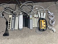 All 16 electrical power bars of various colors and types laid side by side.