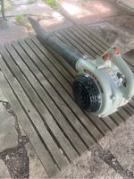 Side view of the full blower showing the nozzle, fan area, and handle