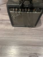 Front view of Fender Frontman 15G amplifier showing controls and Fender logo.