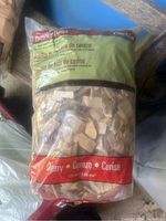 Full bag of Cherry wood chips in plastic packaging, brand not visible