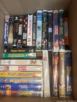 Top view of arranged VHS tapes showing titles on spine and front covers.