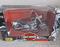 Harley-Davidson 95th Anniversary diecast motorcycle model in protective display box showing front and side profile.