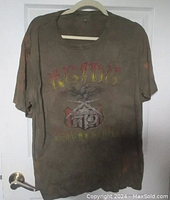 Full front view of khaki green vintage AC/DC Highway to Hell t-shirt with noticeable wear and bleach stains