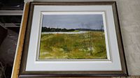 Full view of the framed oil painting showing a landscape with fields, thin trees, and a forest under grey skies.
